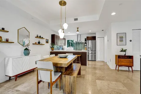 a view of kitchen with cabinets and wooden floor