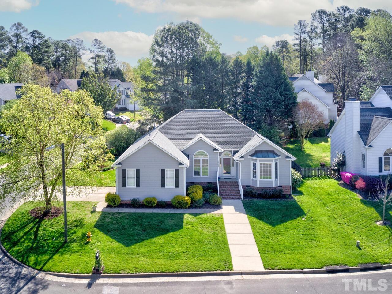 12108 Amoretto Way Raleigh, NC 27613 - Photo 1 of 40 a view of a house with a big yard plants and large trees