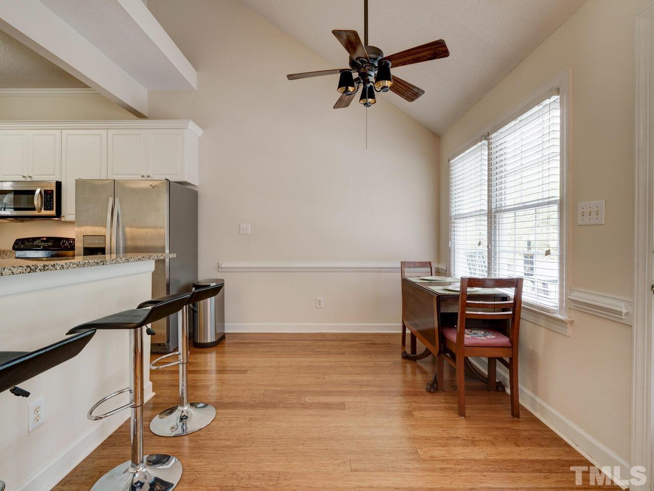 12108 Amoretto Way Raleigh, NC 27613 - Photo 13 of 40 a view of a workspace with furniture and a window