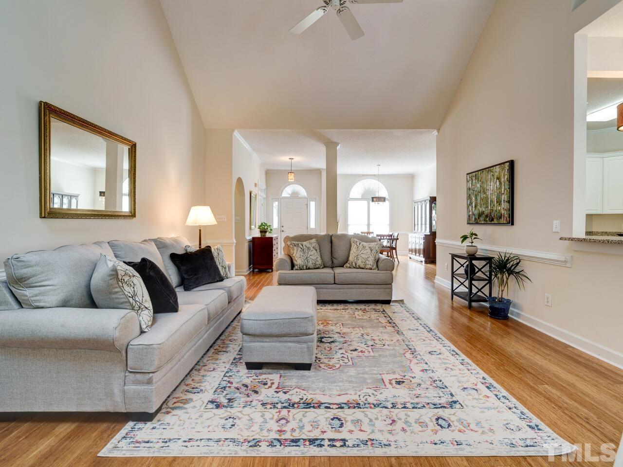 12108 Amoretto Way Raleigh, NC 27613 - Photo 15 of 40 a living room with furniture and a rug