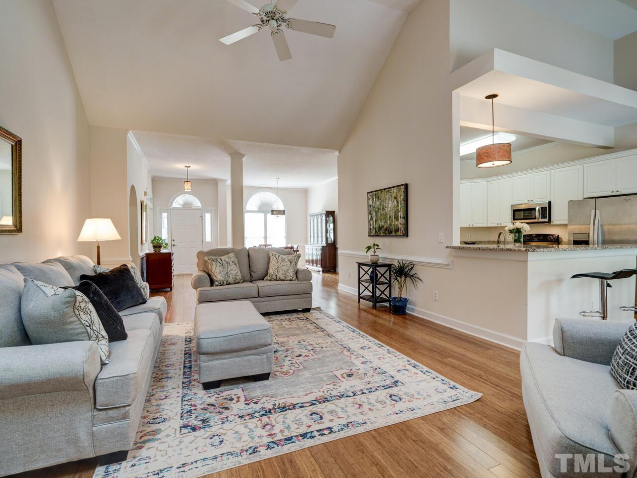 12108 Amoretto Way Raleigh, NC 27613 - Photo 19 of 40 a living room with furniture and wooden floor