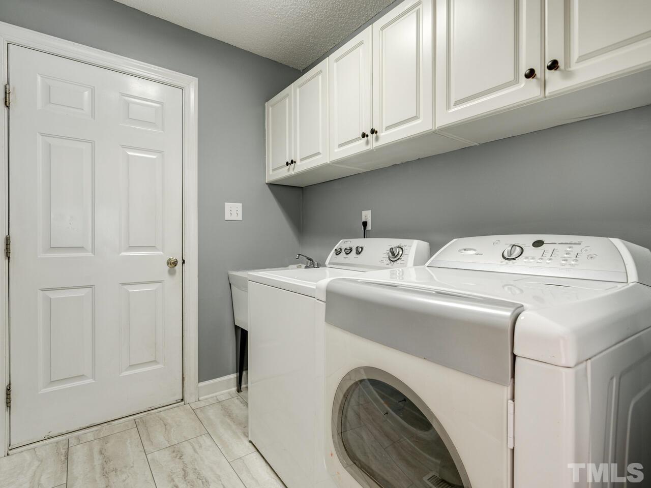 12108 Amoretto Way Raleigh, NC 27613 - Photo 36 of 40 a utility room with dryer and washer