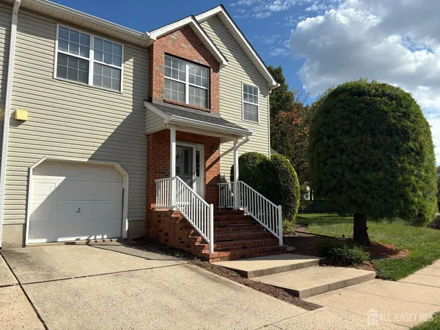 a front view of a house with a large windows