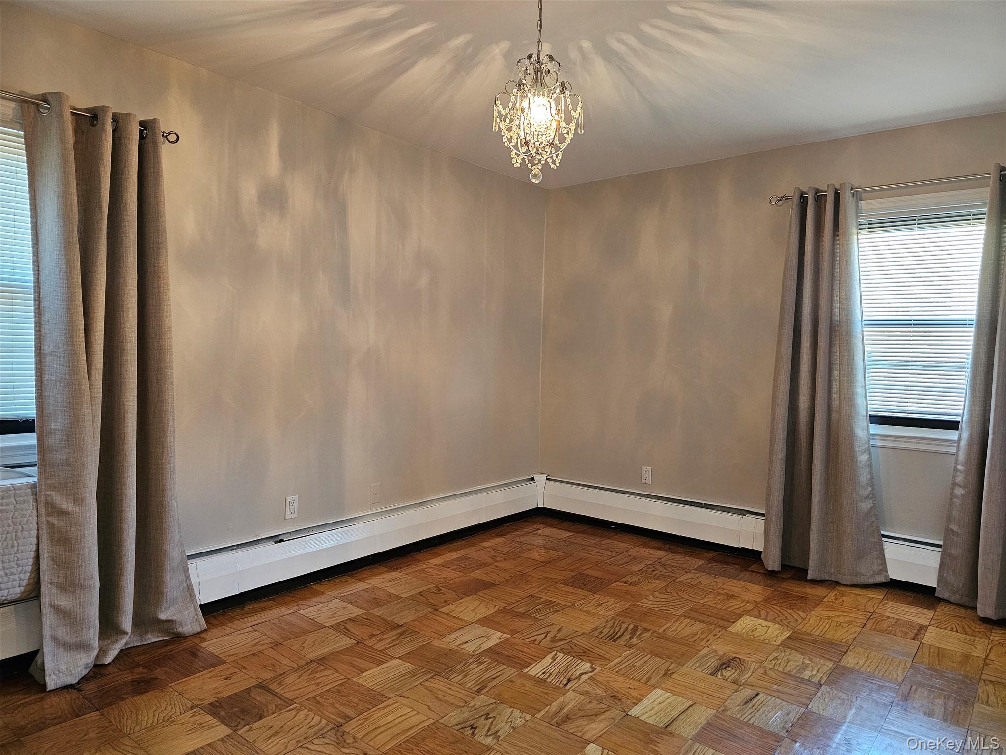 2261 Palmer Avenue, Unit 3C New Rochelle, NY 10801 - Photo 13 of 23 an empty room with wooden floor and window