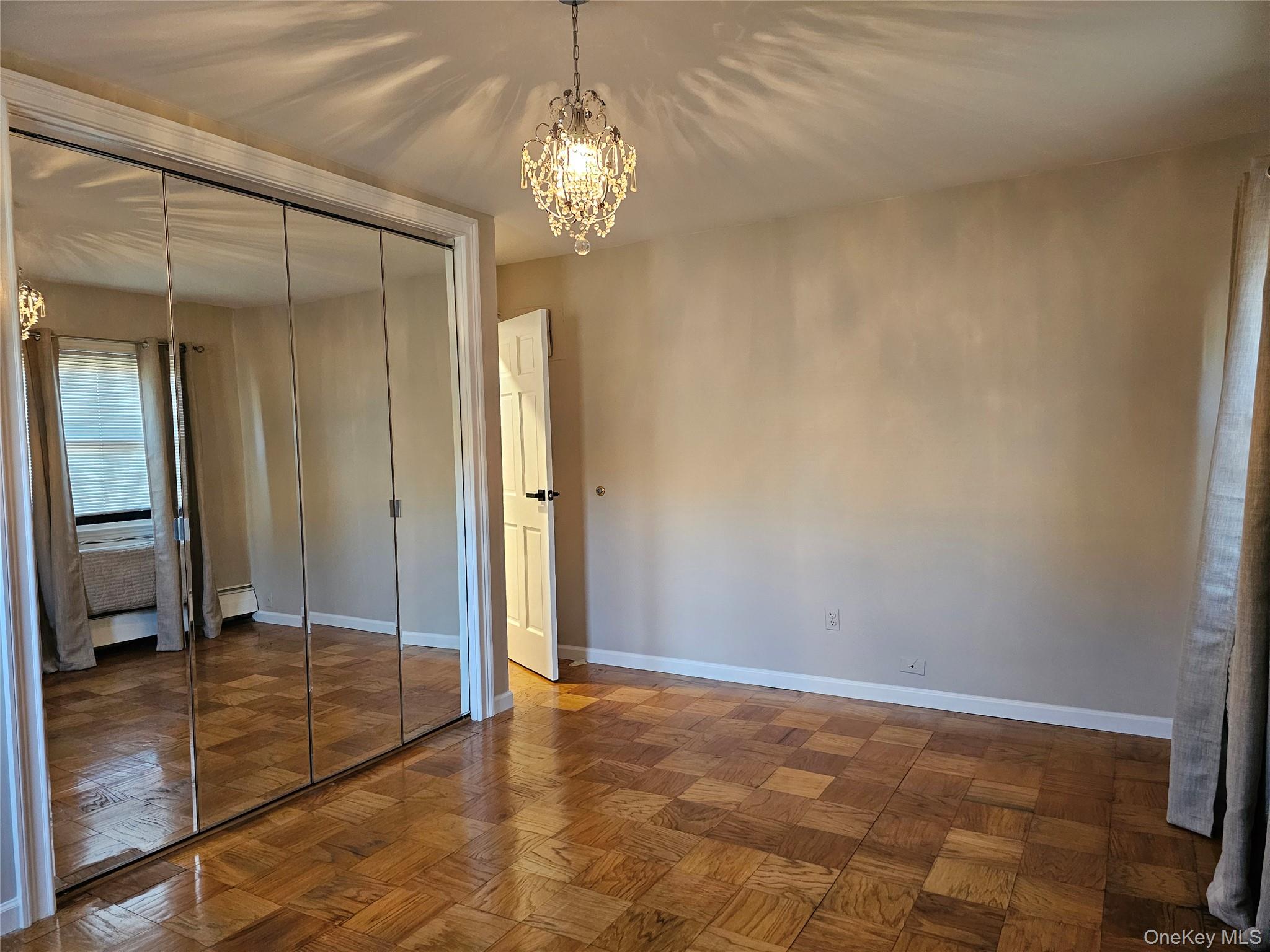 2261 Palmer Avenue, Unit 3C New Rochelle, NY 10801 - Photo 14 of 23 a view of a hallway with wooden floor