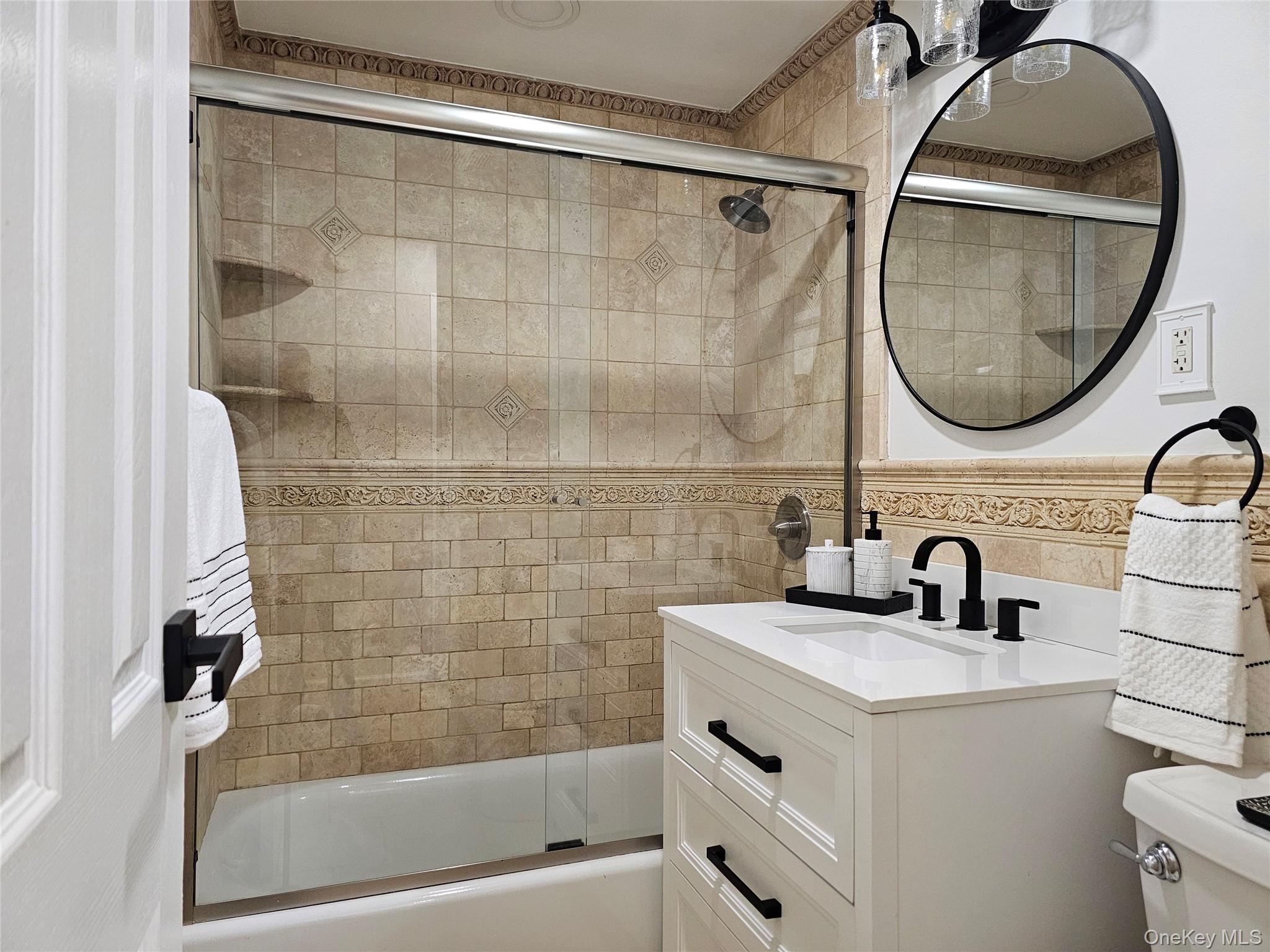 2261 Palmer Avenue, Unit 3C New Rochelle, NY 10801 - Photo 16 of 23 a bathroom with a sink a mirror and a shower
