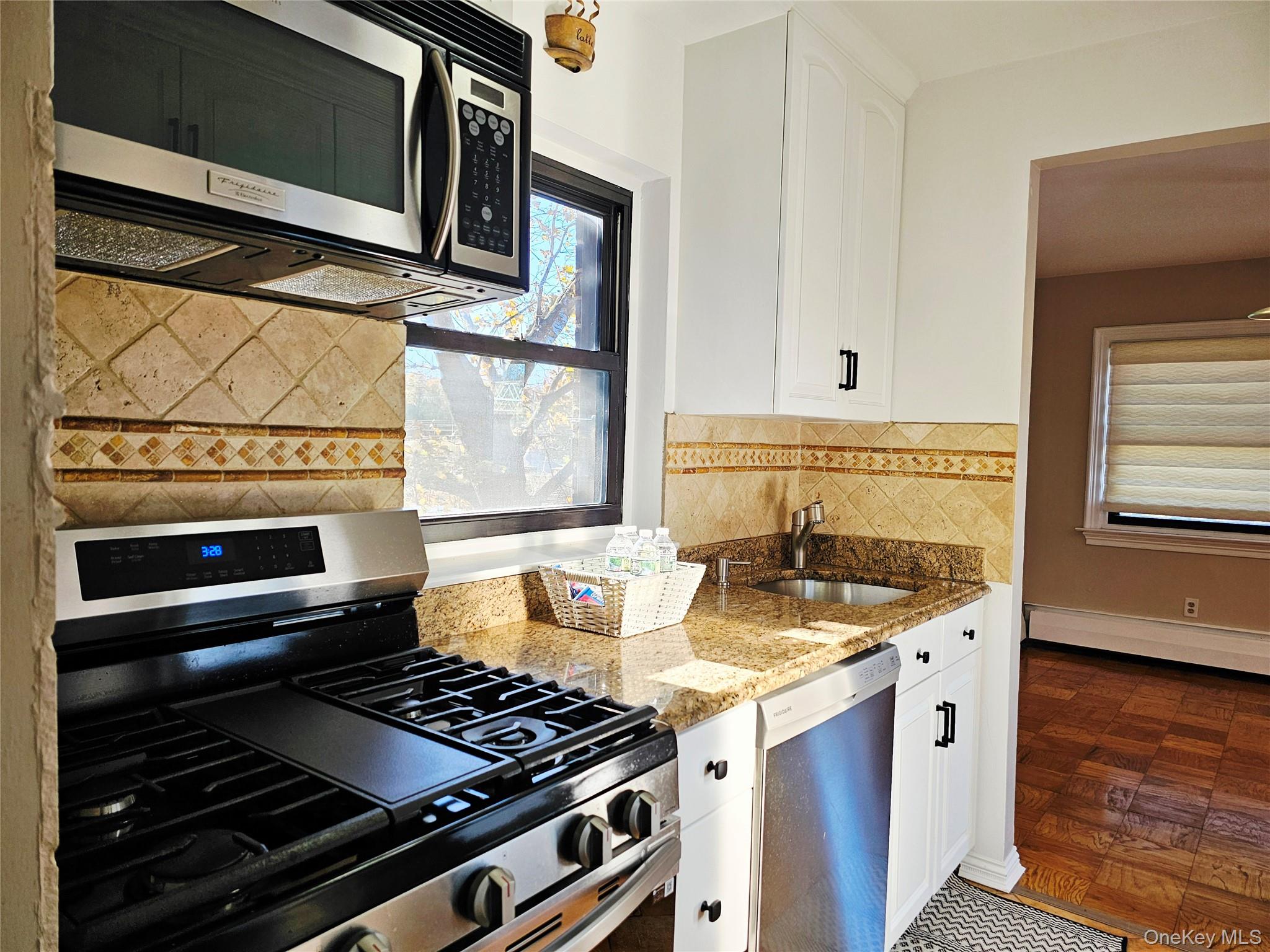 2261 Palmer Avenue, Unit 3C New Rochelle, NY 10801 - Photo 3 of 23 a kitchen with a stove and a microwave