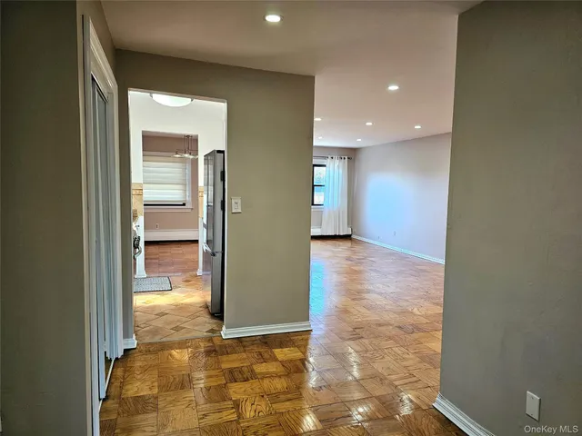 a view of a hallway with bathroom