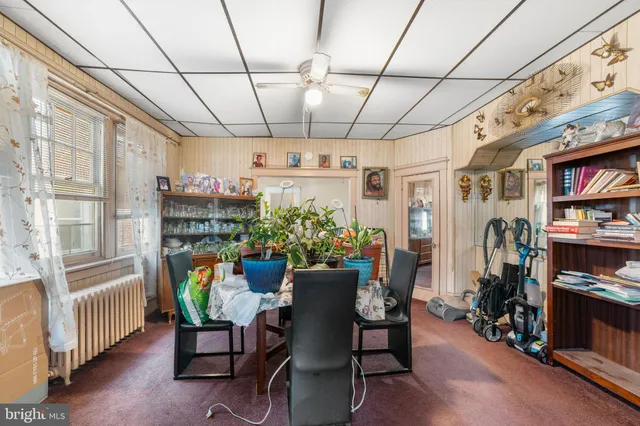 a view of a dining room with furniture window and entryway