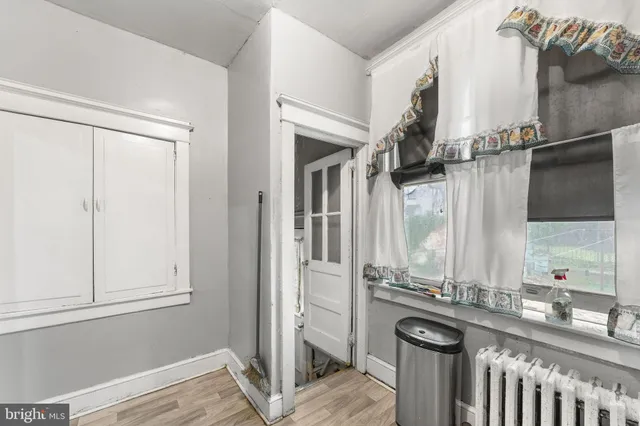 a view of a bathroom with a sink and mirror