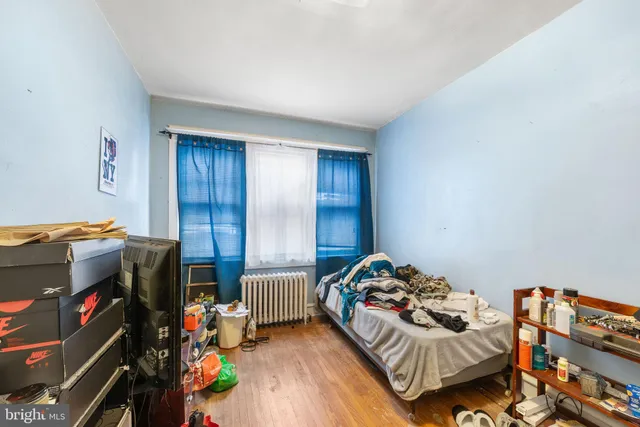 a bedroom with bed and a window