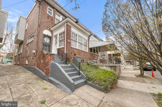 a view of a large building with a yard