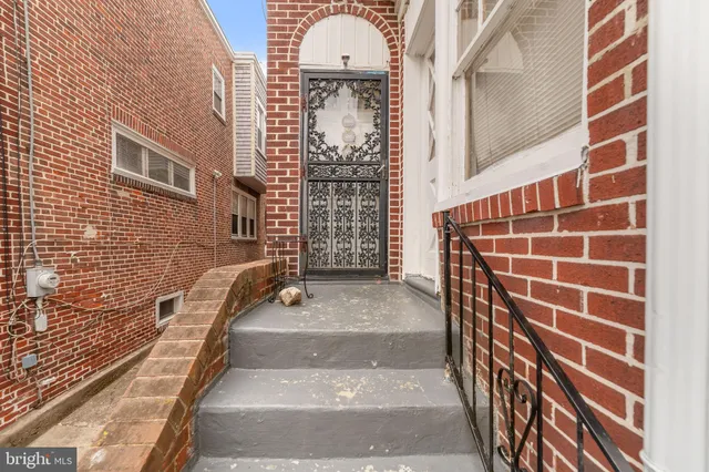 a view of a brick building with many windows