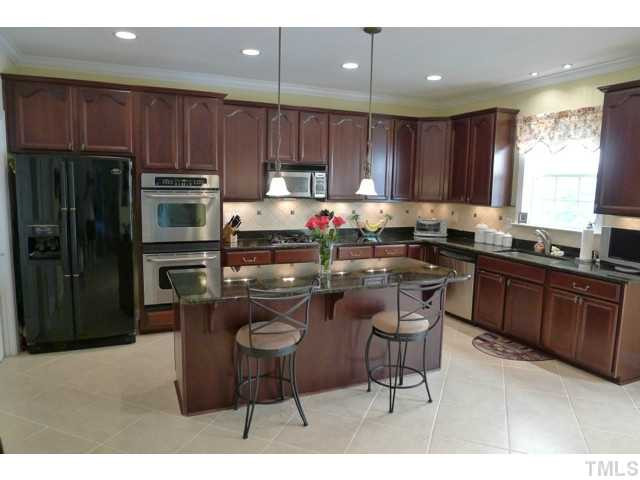 316 Powers Ferry Road Cary, NC 27519 - Photo 5 of 25 The large kitchen has all the features present on most all buyer wish lists: granite, stainless apps, gas cooktop, an abundance of maple cabinetry, huge center island, 18 Italian tile floors, tile backsplash, under-cabinet lighting & a walk-in pantry. Kitchen