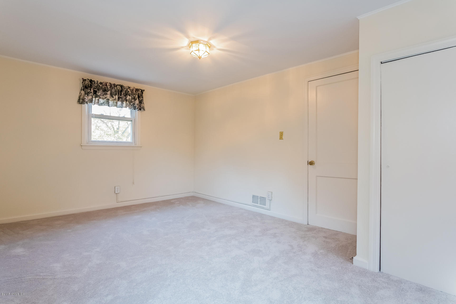 34 Wescott Street Riverside, CT 06878 - Photo 18 of 26 a view of an empty room with a window