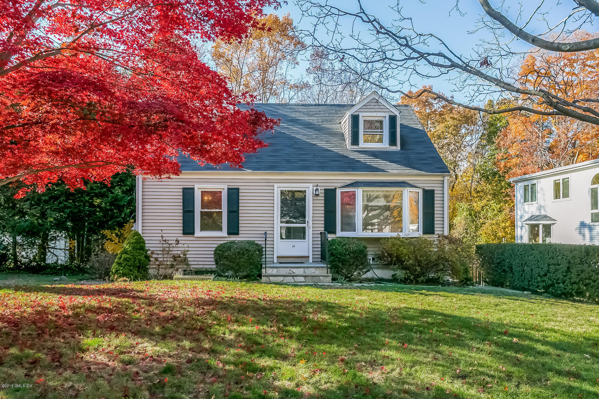 34 Wescott Street Riverside, CT 06878 - Photo 2 of 26 a front view of a house with garden
