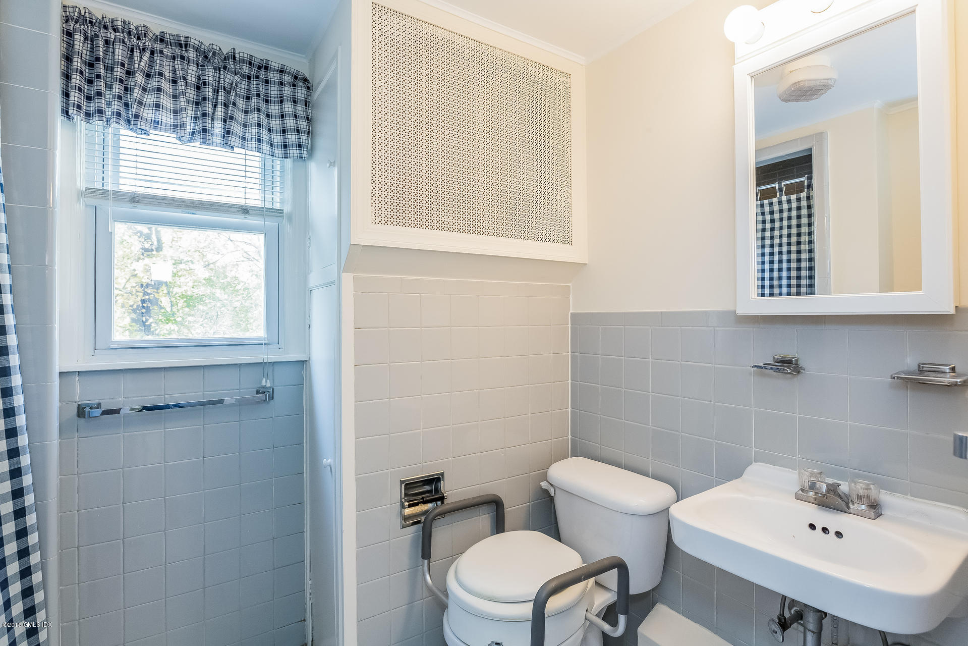 34 Wescott Street Riverside, CT 06878 - Photo 21 of 26 a bathroom with a sink a toilet and a window