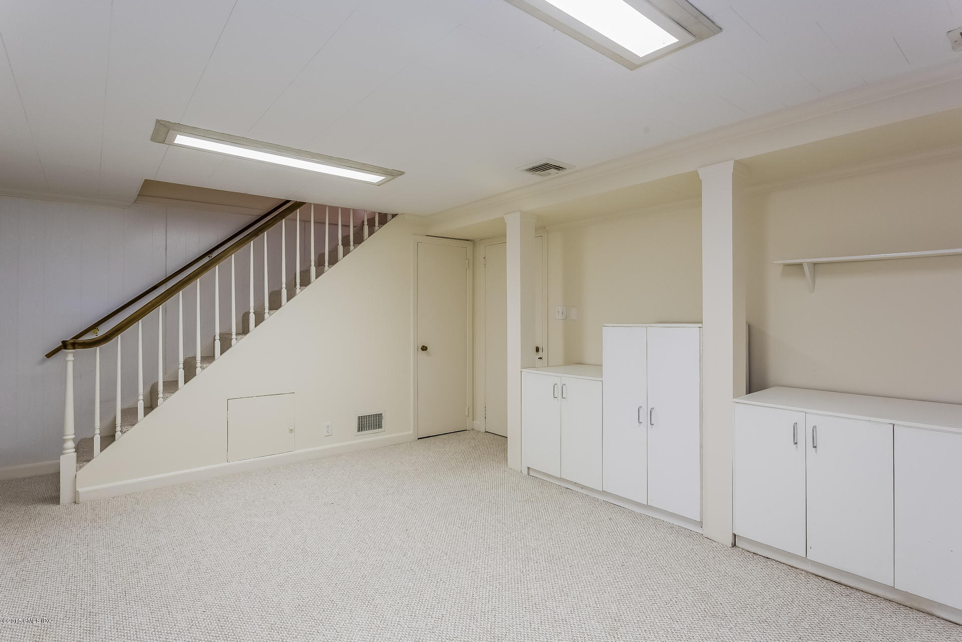 34 Wescott Street Riverside, CT 06878 - Photo 22 of 26 a view of room with white walls and stairs