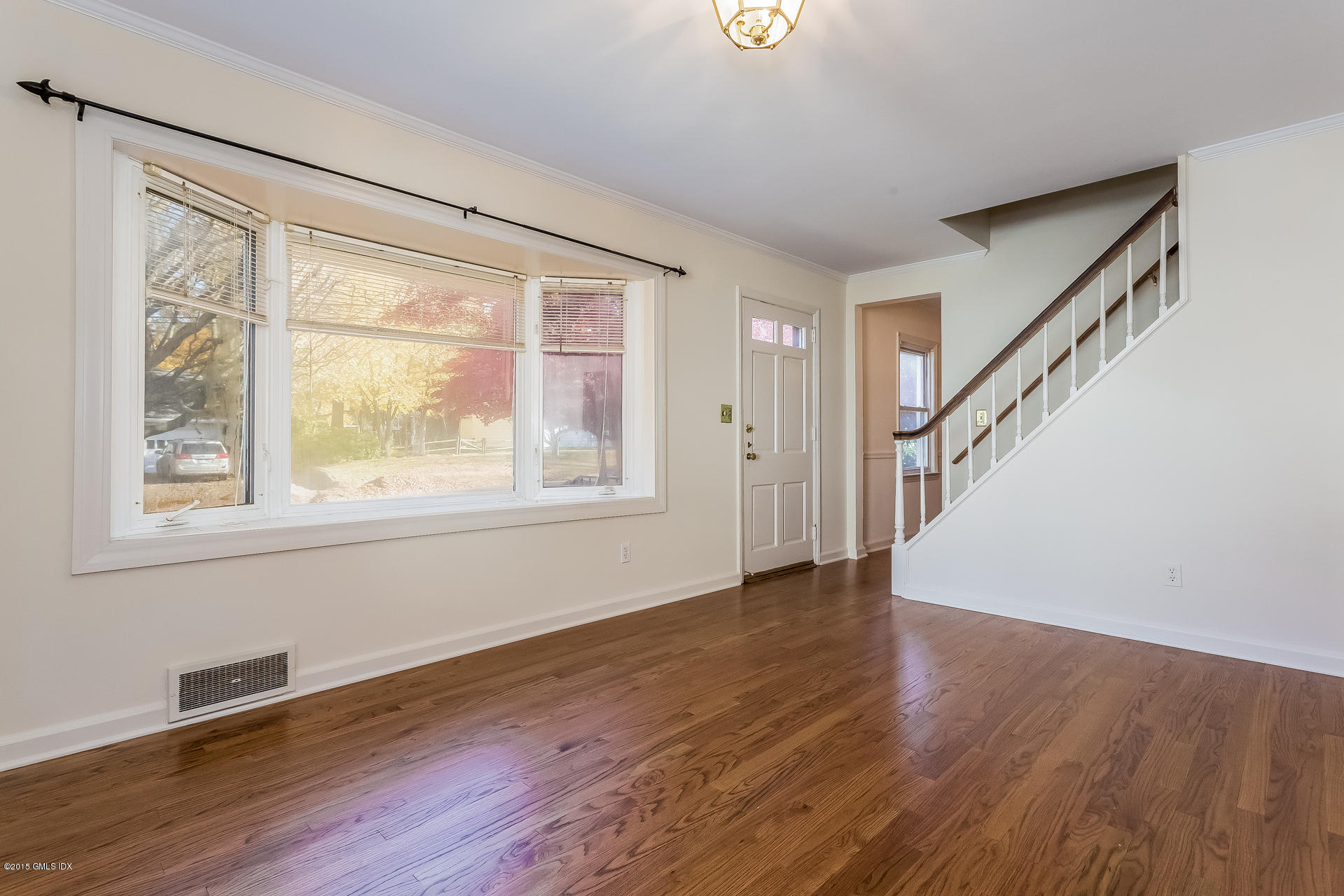 34 Wescott Street Riverside, CT 06878 - Photo 4 of 26 a view of an empty room with wooden floor and a window
