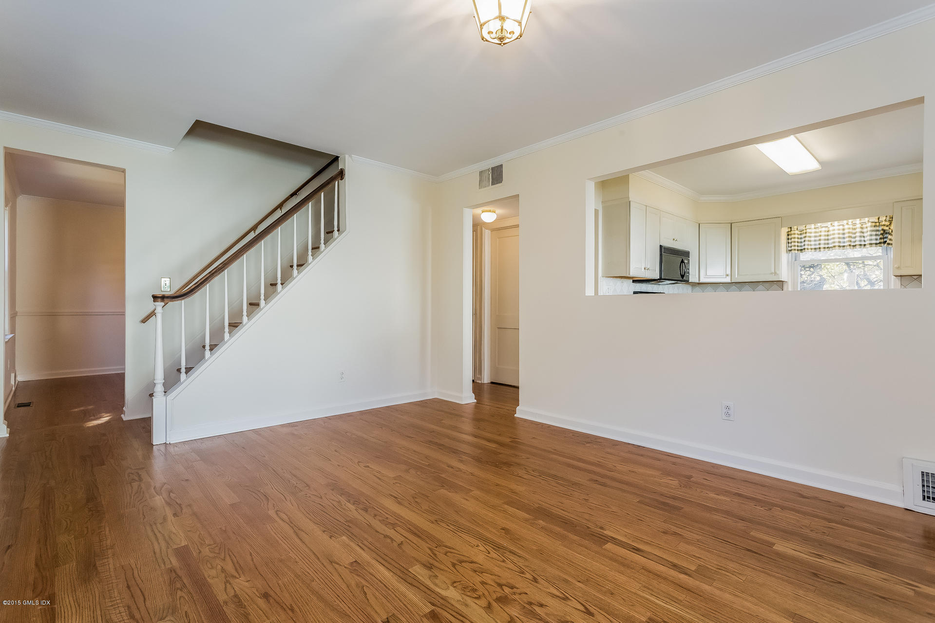 34 Wescott Street Riverside, CT 06878 - Photo 5 of 26 a view of an empty room with wooden floor and stairs