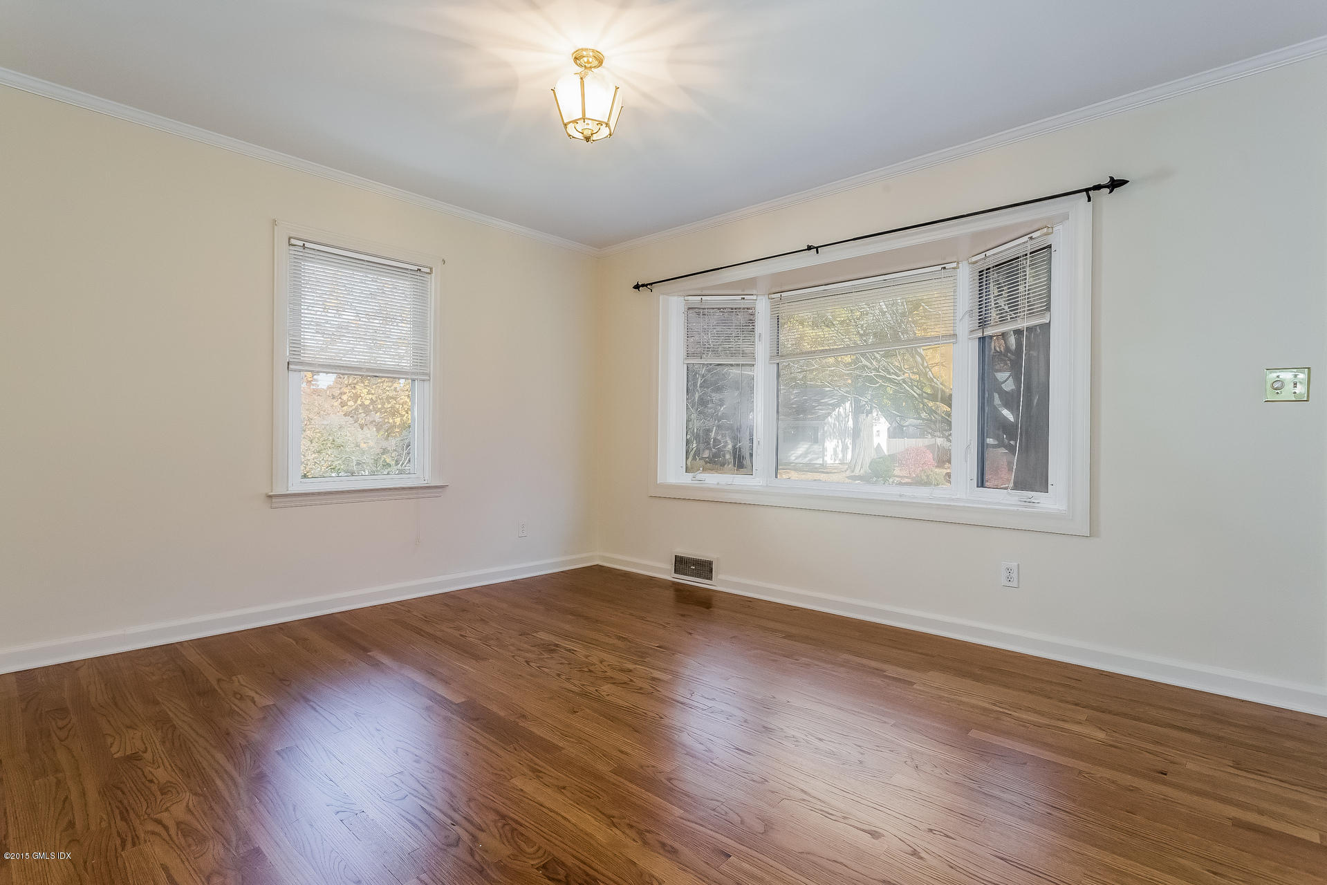 34 Wescott Street Riverside, CT 06878 - Photo 7 of 26 a view of an empty room with wooden floor and a window