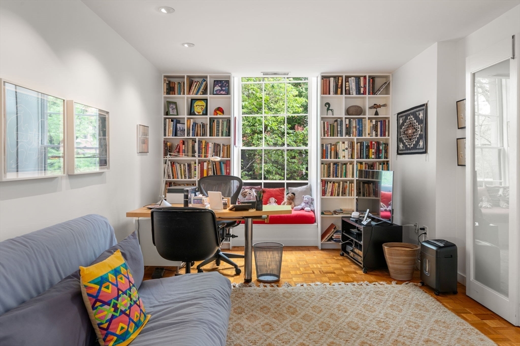 72 Mt Vernon Street, Unit 2A Boston, MA 02108 - Photo 13 of 25 a living room with furniture and a bookshelf