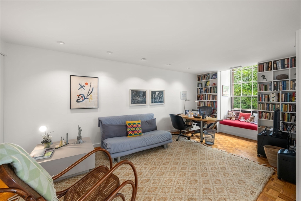 72 Mt Vernon Street, Unit 2A Boston, MA 02108 - Photo 14 of 25 a living room with furniture and a floor to ceiling window