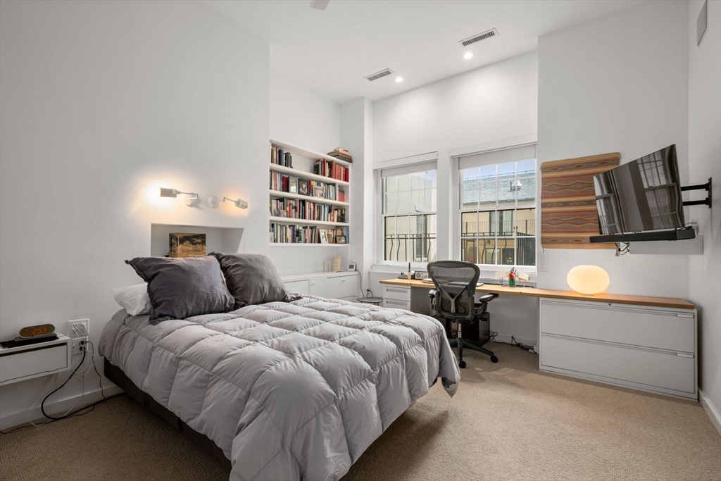 72 Mt Vernon Street, Unit 2A Boston, MA 02108 - Photo 15 of 25 a bed room with a bed tv and a window