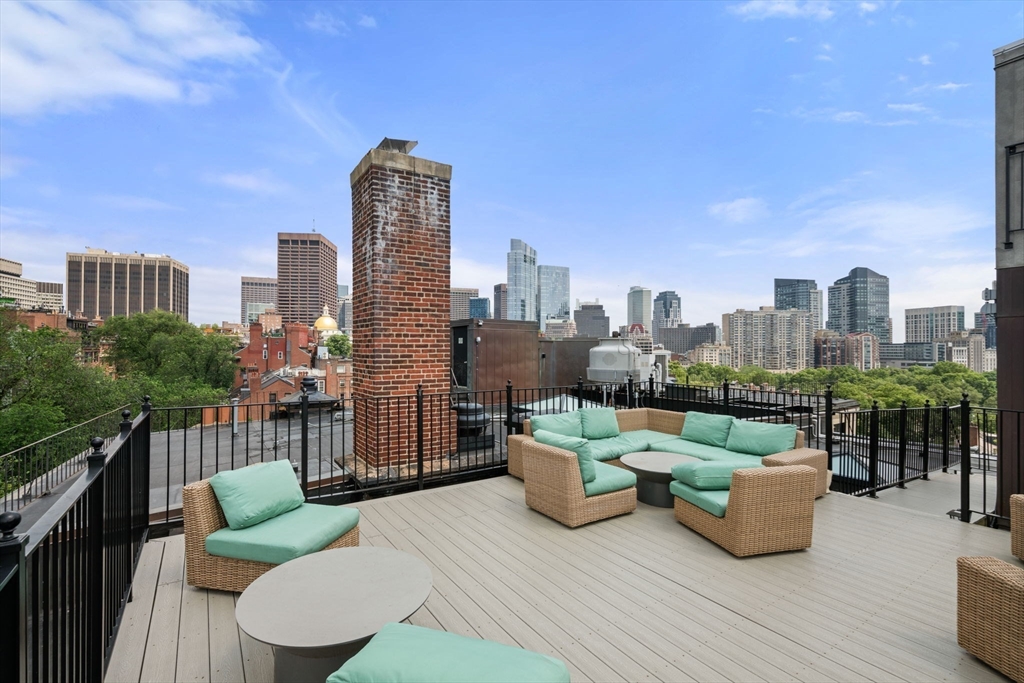 72 Mt Vernon Street, Unit 2A Boston, MA 02108 - Photo 18 of 25 a view of a roof deck with couches and potted plants