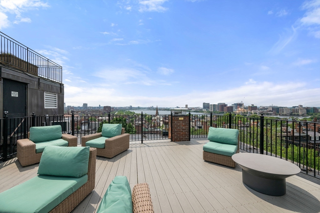 72 Mt Vernon Street, Unit 2A Boston, MA 02108 - Photo 19 of 25 a view of roof deck with couches and potted plants
