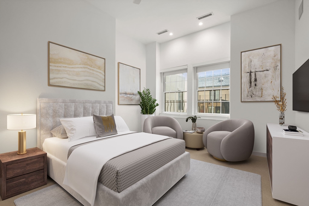 72 Mt Vernon Street, Unit 2A Boston, MA 02108 - Photo 3 of 25 a bedroom with bed and flat screen tv