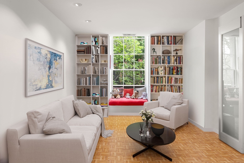 72 Mt Vernon Street, Unit 2A Boston, MA 02108 - Photo 5 of 25 a living room with furniture and a book shelf