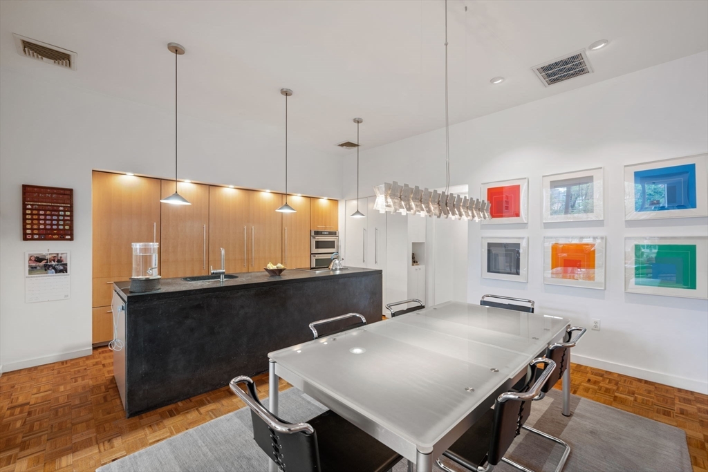 72 Mt Vernon Street, Unit 2A Boston, MA 02108 - Photo 10 of 25 a dinning table and chairs in a room