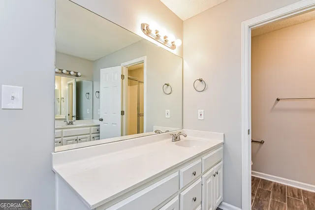 a bathroom with a sink and a mirror