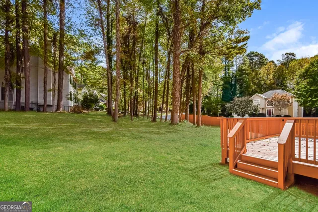 a view of a park with large trees