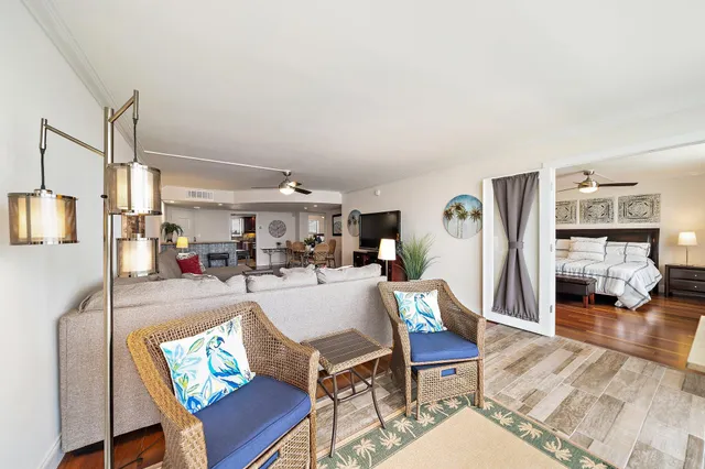 a living room with furniture and wooden floor