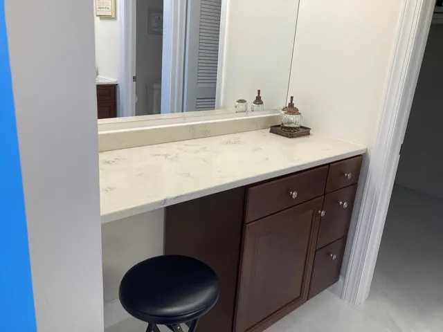 a bathroom with a glass shower door