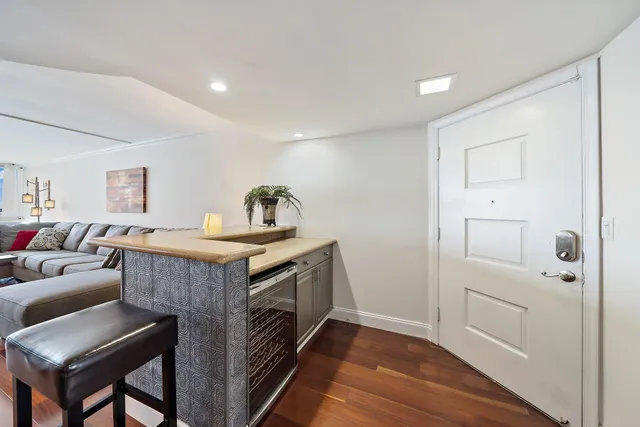 a view of room with furniture and wooden floor