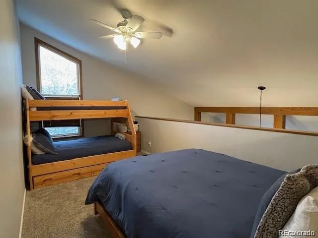 a bedroom with bed and a window