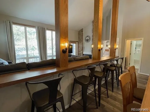 a view of a dining room with furniture and window