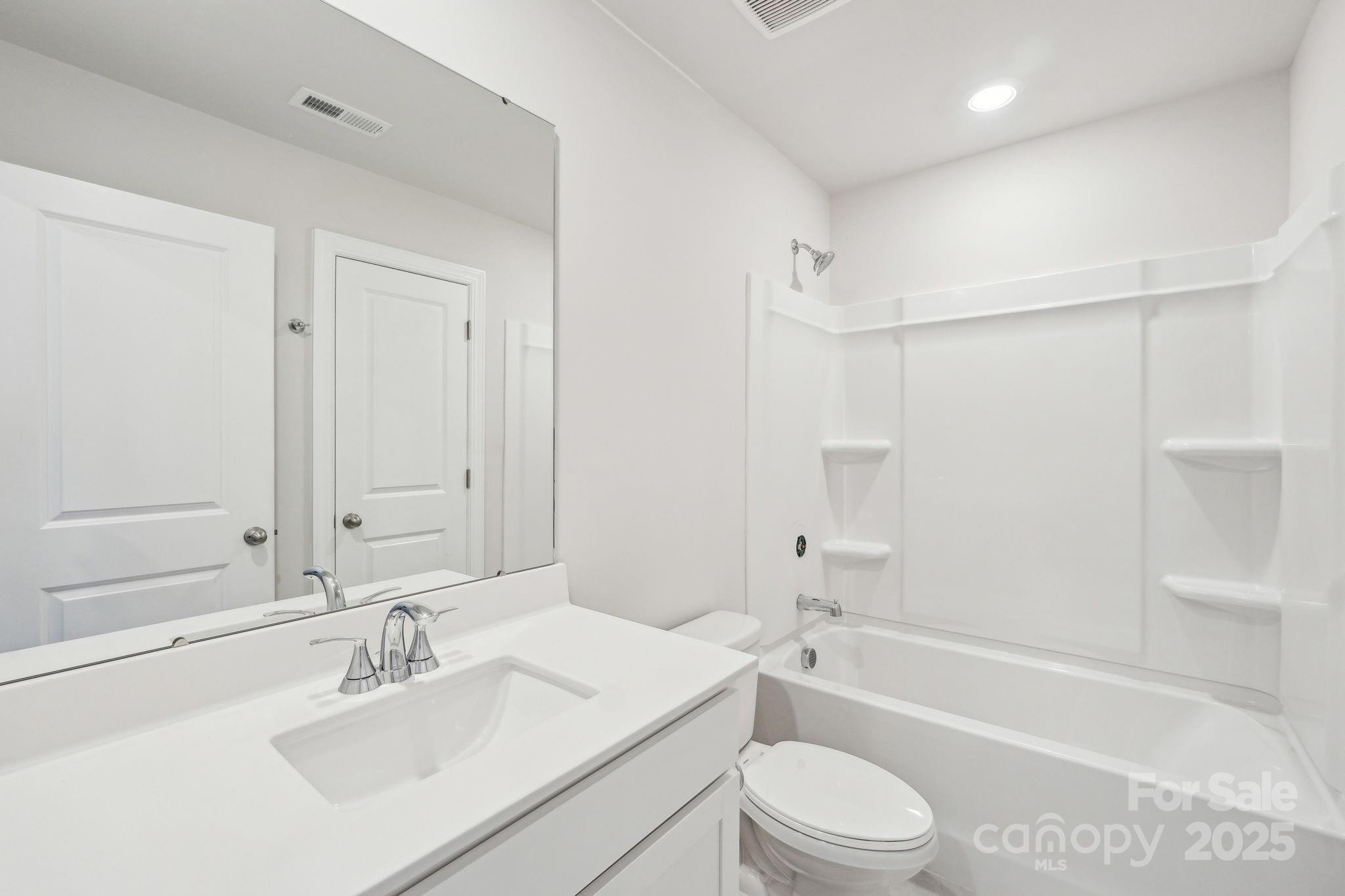 1516 31st Street Northeast Conover, NC 28613 - Photo 12 of 18 a bathroom with a sink a toilet and shower