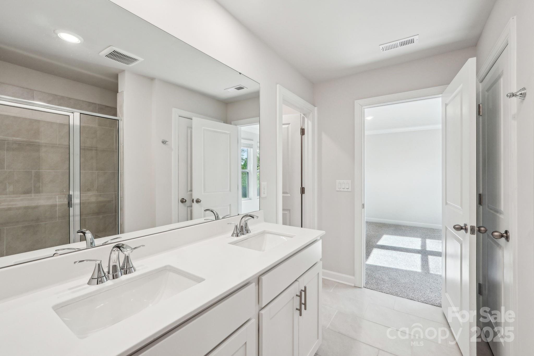 1516 31st Street Northeast Conover, NC 28613 - Photo 18 of 18 a bathroom with a sink double vanity and a mirror