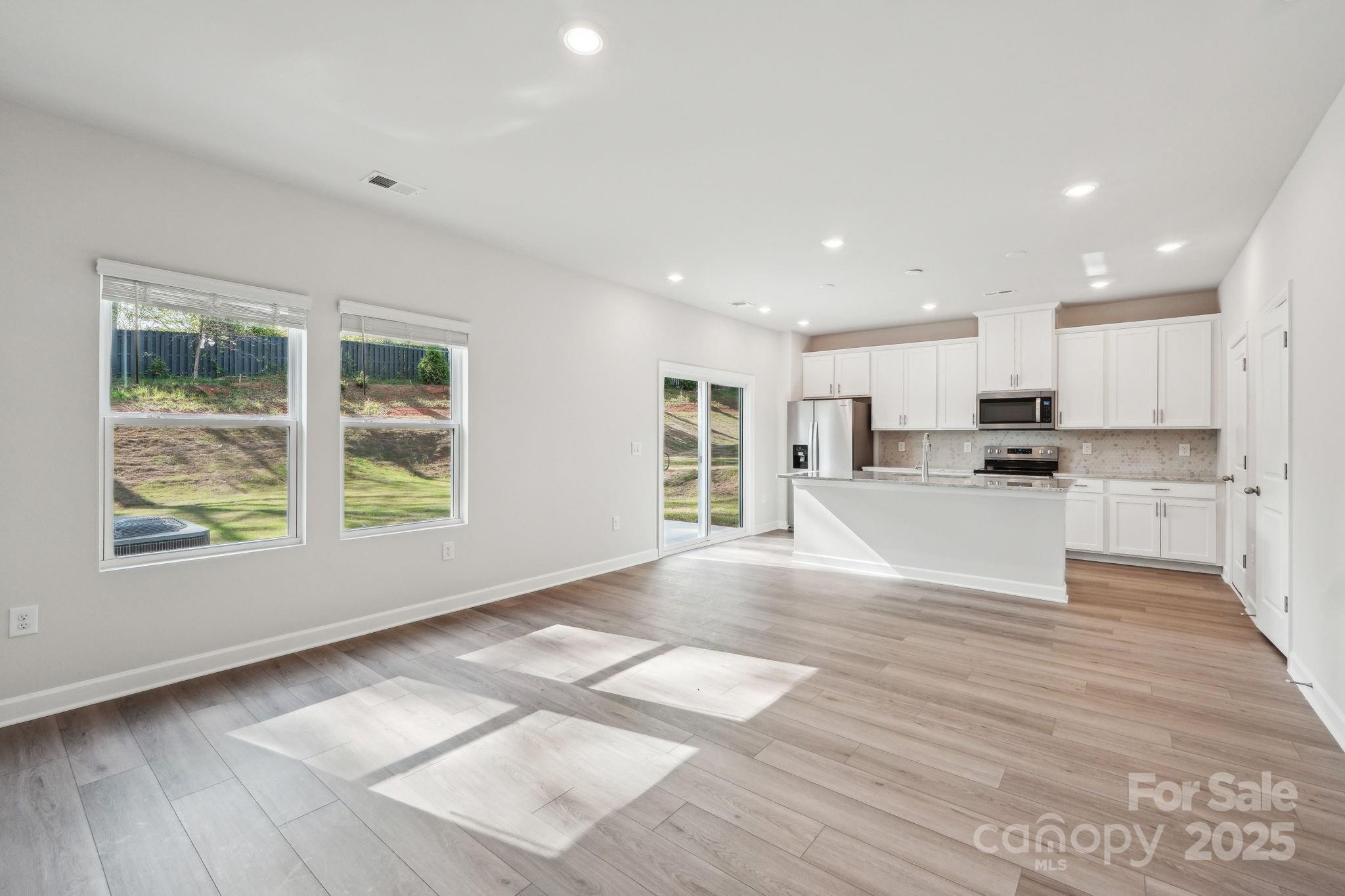 1516 31st Street Northeast Conover, NC 28613 - Photo 5 of 18 a view of kitchen with wooden floor and window