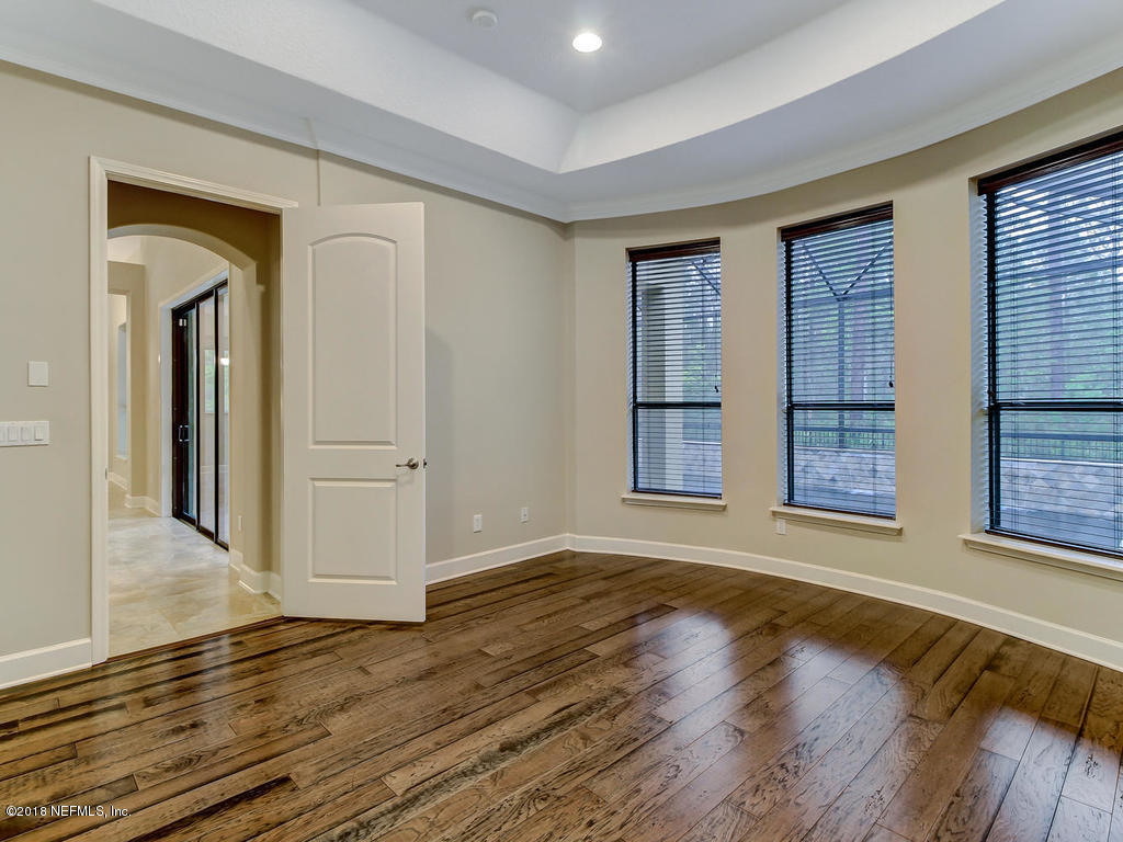 213 North Saxxon Road St. Augustine, FL 32092 - Photo 34 of 88 a view of an empty room with wooden floor and a window