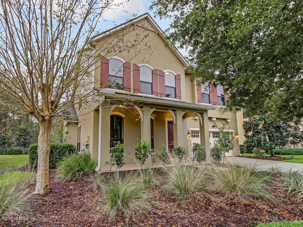 213 North Saxxon Road St. Augustine, FL 32092 - Photo 4 of 88 a front view of a house with garden