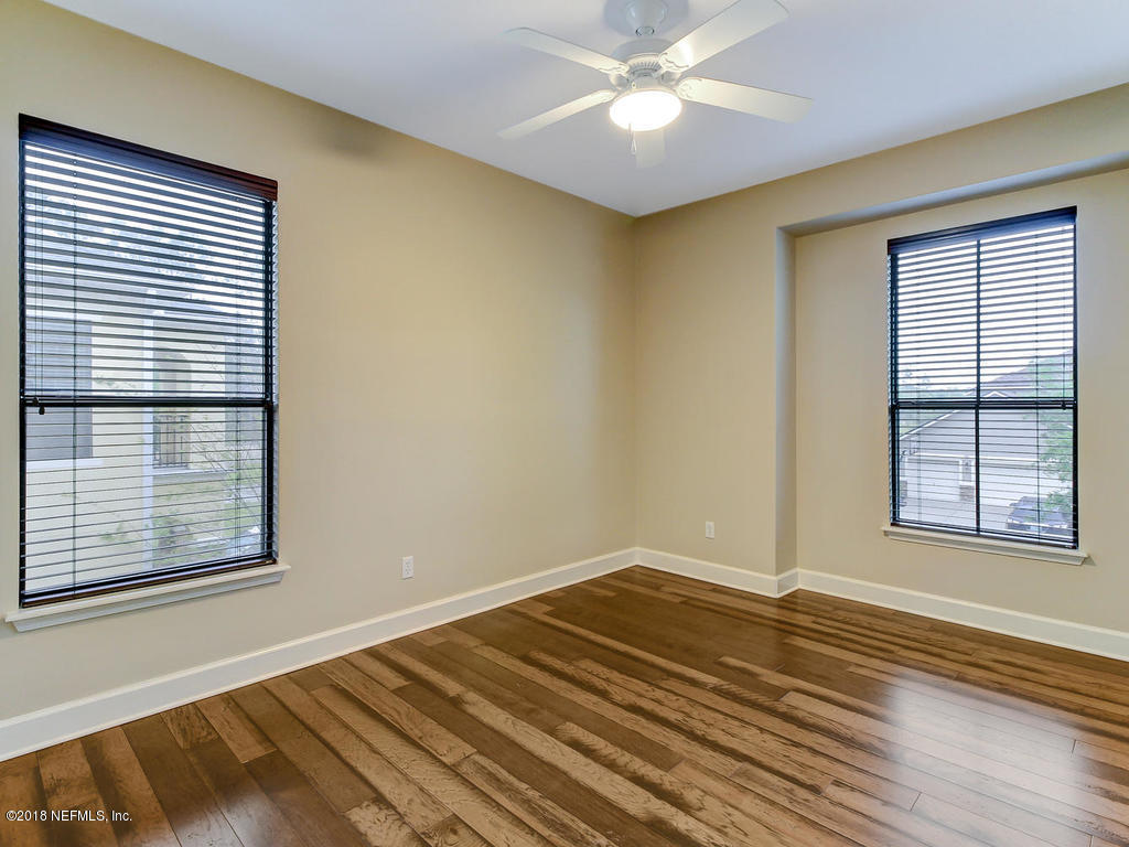 213 North Saxxon Road St. Augustine, FL 32092 - Photo 54 of 88 a view of a livingroom with wooden floor and a window