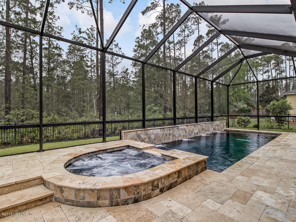 213 North Saxxon Road St. Augustine, FL 32092 - Photo 66 of 88 a view of a swimming pool with a patio and a yard