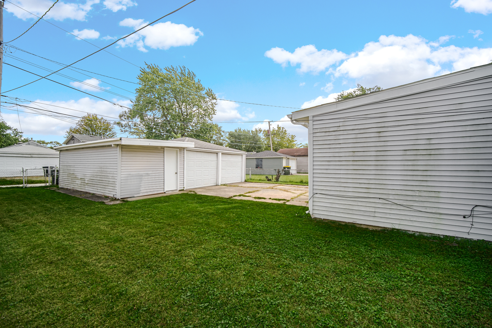 17137 Chicago Avenue Lansing, IL 60438 - Photo 11 of 11 a view of a backyard with plants and a patio