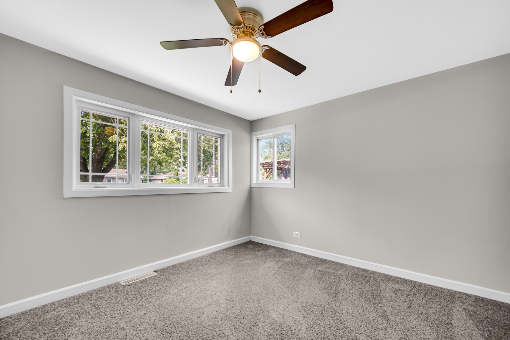17137 Chicago Avenue Lansing, IL 60438 - Photo 8 of 11 an empty room with a window and a fan