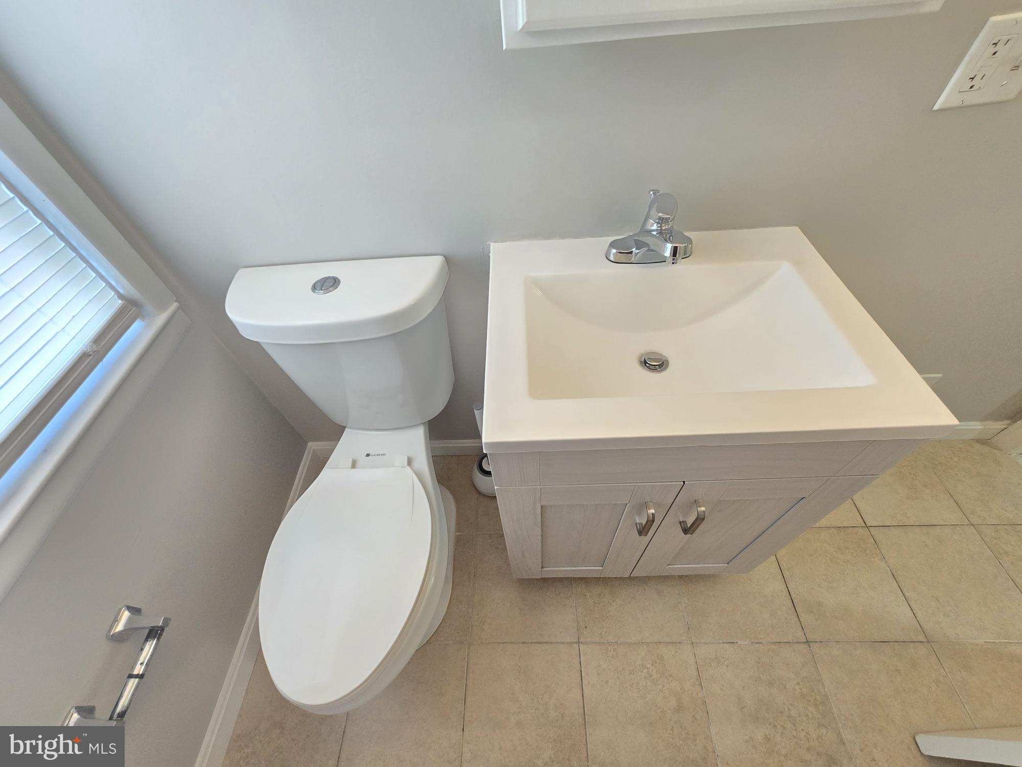 1225 Cochran Avenue Baltimore, MD 21239 - Photo 14 of 22 a bathroom with a sink and a toilet